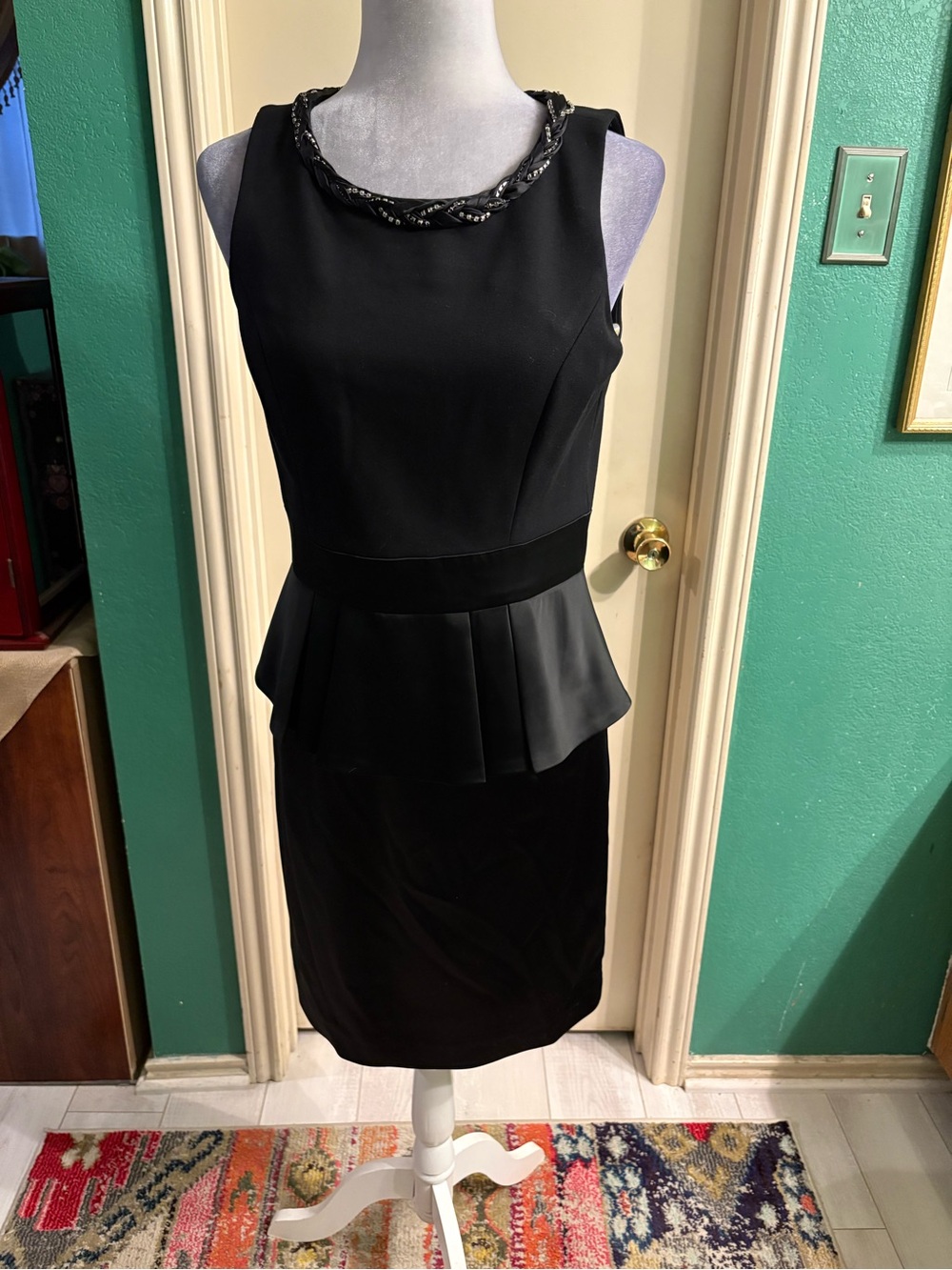 Taylor Black Sleeveless Peplum Midi Dress with Embellished Neckline